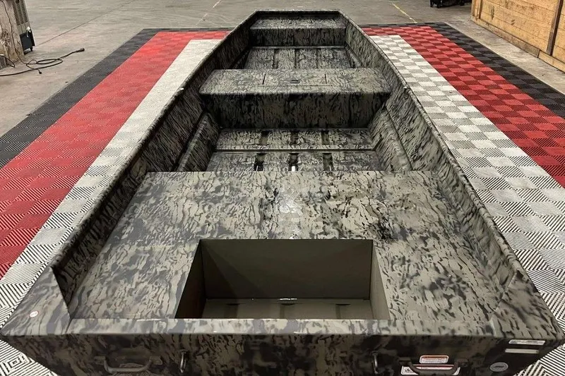 Slide: The Image of 2026 Tracker Grizzly® 15 Jon boat with camouflage design on display. - 2