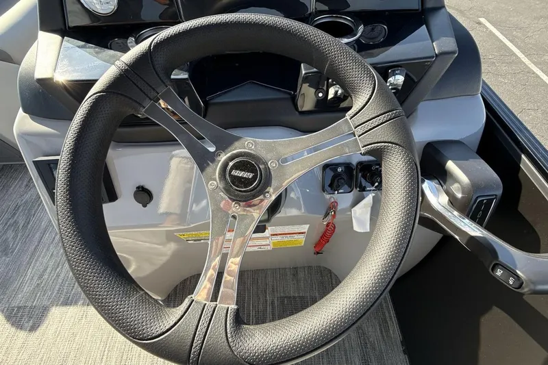 Slide: The Image of Steering wheel of 2026 Landau Island Breeze 232 Sport Cruise boat. - 14
