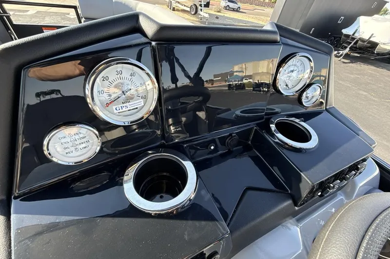 Slide: The Image of Dashboard of 2026 Landau Island Breeze 232 Sport Cruise with gauges and cup holders. - 15