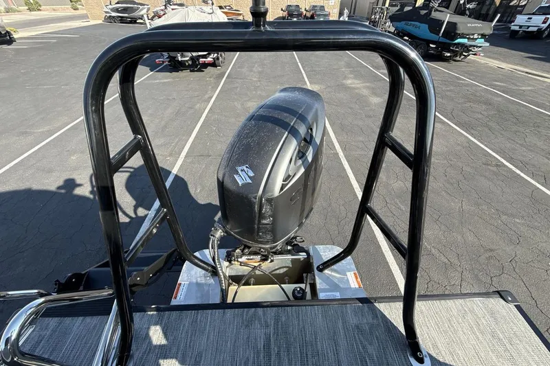 Slide: The Image of 2026 Landau Island Breeze 232 Sport Cruise with Suzuki outboard motor in parking lot. - 18