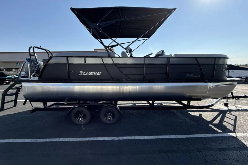 Slide: The Image of 2026 Landau Island Breeze 232 Sport Cruise pontoon boat on trailer, side view. - 6