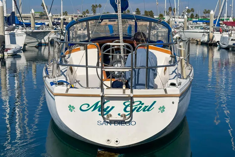 Slide: The Image of 1984 Catalina 30 sailboat named "My Girl" docked in San Diego marina. - 16