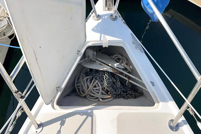 Slide: The Image of Anchor and rope storage on 1984 Catalina 30 sailboat deck. - 23
