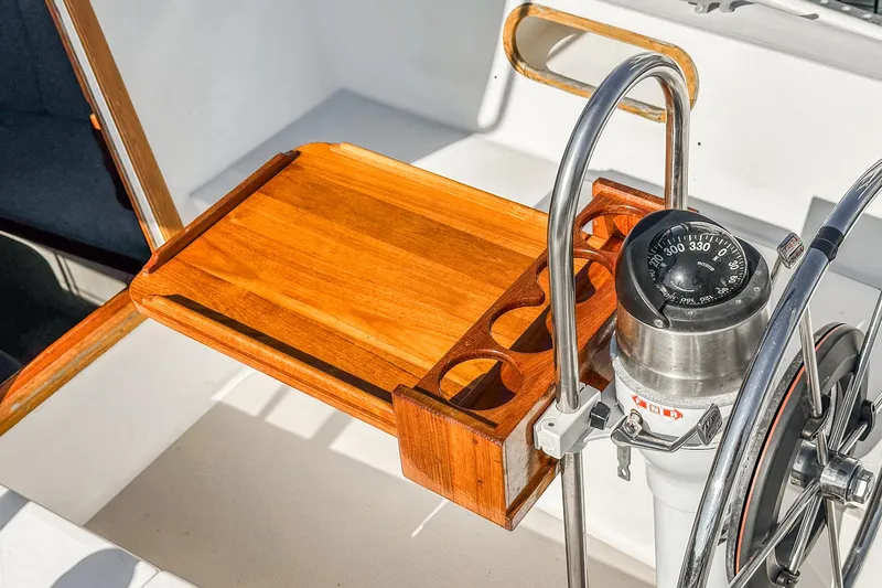 Slide: The Image of Cockpit of 1984 Catalina 30 sailboat with wooden tray and compass. - 38