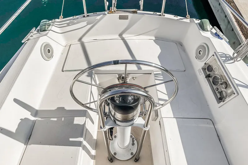 Slide: The Image of Cockpit of 1984 Catalina 30 sailboat with steering wheel and navigation instruments. - 39