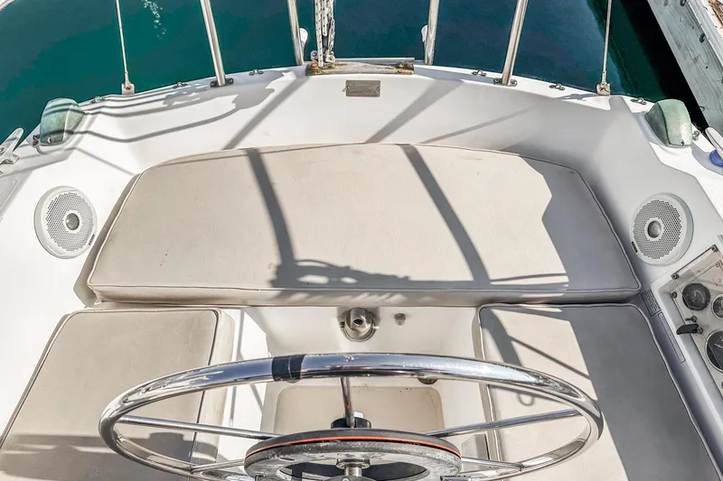 Slide: The Image of Cockpit of a 1984 Catalina 30 sailboat with steering wheel and seating. - 41
