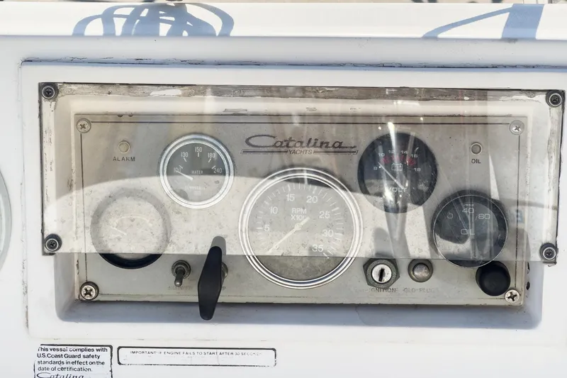 Slide: The Image of Dashboard of a 1984 Catalina 30 sailboat with gauges and controls. - 42