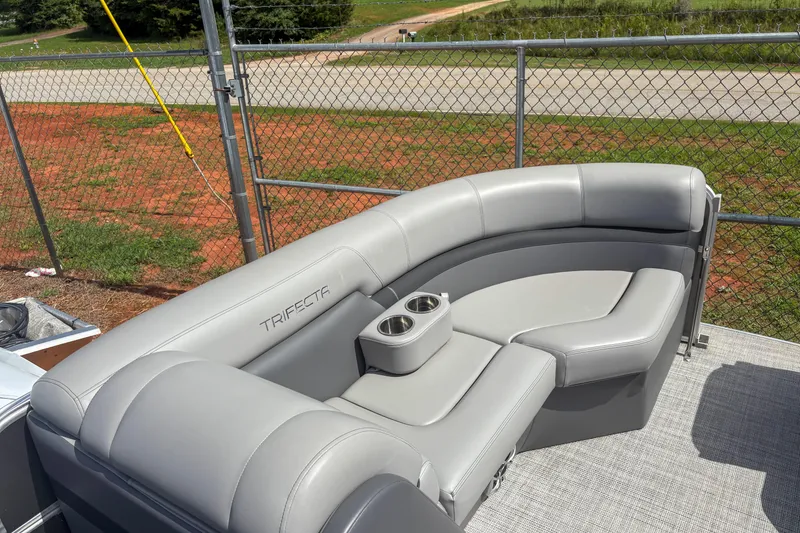 Slide: The Image of Gray seating on a 2021 Trifecta 22C CS 2.75 pontoon boat, featuring cup holders. - 11