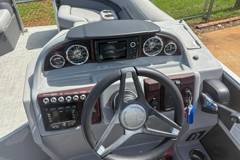 Slide: The Image of Steering console of 2021 Trifecta 22C CS 2.75 boat with gauges and controls. - 8