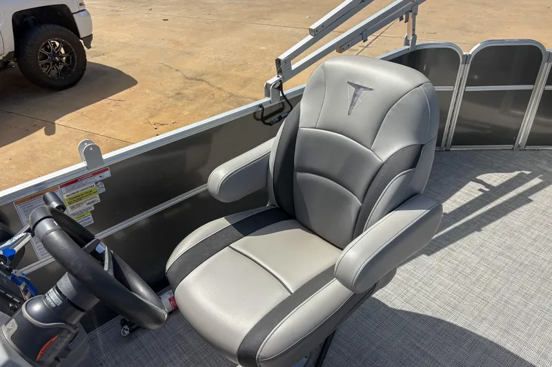 Slide: The Image of Captain's chair on 2021 Trifecta 22C CS 2.75 pontoon boat, featuring sleek design and comfortable seating. - 9