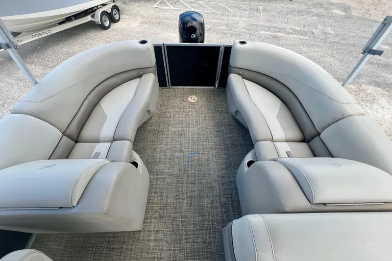 Slide: The Image of 2023 Cypress Cay Seabreeze 232 pontoon boat interior with plush seating and modern design. - 11