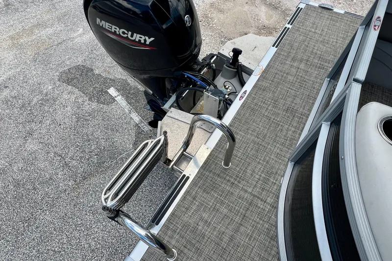 Slide: The Image of 2023 Cypress Cay Seabreeze 232 boat with Mercury engine and swim ladder. - 13