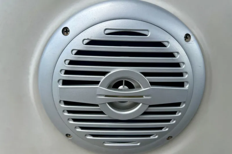 Slide: The Image of Close-up of a speaker grille on a 2023 Cypress Cay Seabreeze 232 boat. - 19