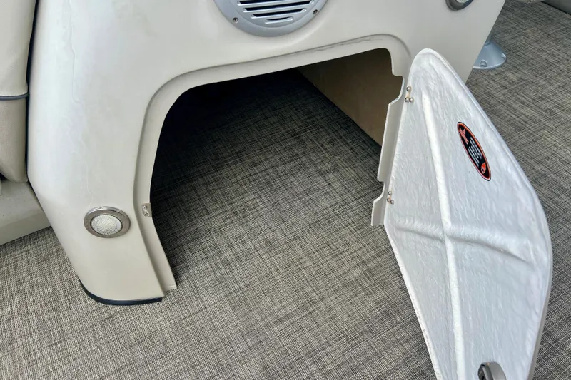 Slide: The Image of 2023 Cypress Cay Seabreeze 232 boat storage compartment with open hatch. - 20