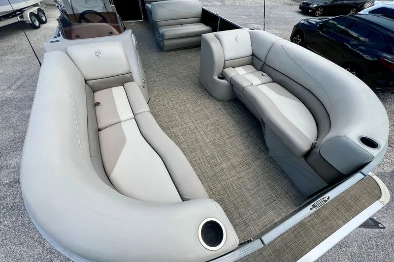 Slide: The Image of 2023 Cypress Cay Seabreeze 232 pontoon boat with spacious seating and modern interior design. - 9