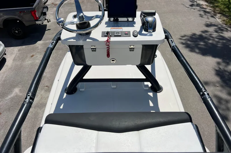 Slide: The Image of 2021 Robalo 246 Cayman SD boat helm with steering wheel and controls. - 19