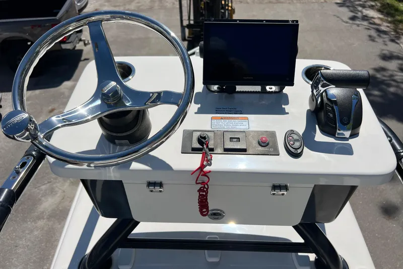 Slide: The Image of 2021 Robalo 246 Cayman SD boat console with steering wheel and controls. - 20