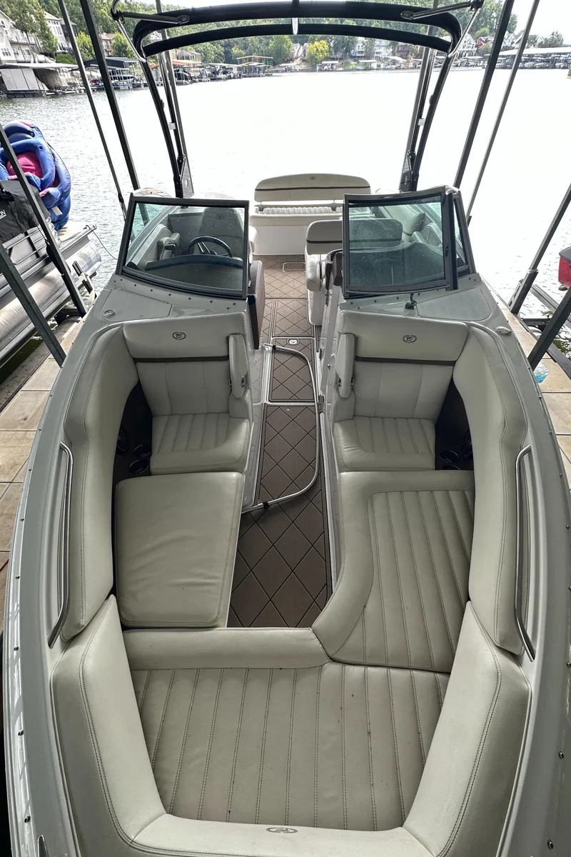 Slide: The Image of 2015 Cobalt R7 boat interior with beige seating and open bow design. - 12