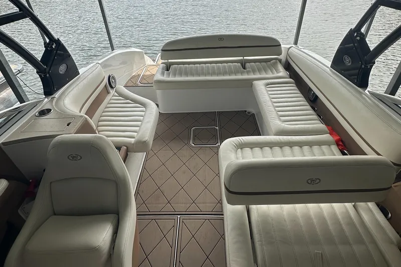 Slide: The Image of 2015 Cobalt R7 boat interior with luxurious white seating and elegant design. - 14