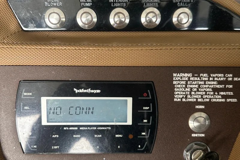 Slide: The Image of Control panel of a 2015 Cobalt R7 boat with Rockford Fosgate media player. - 19