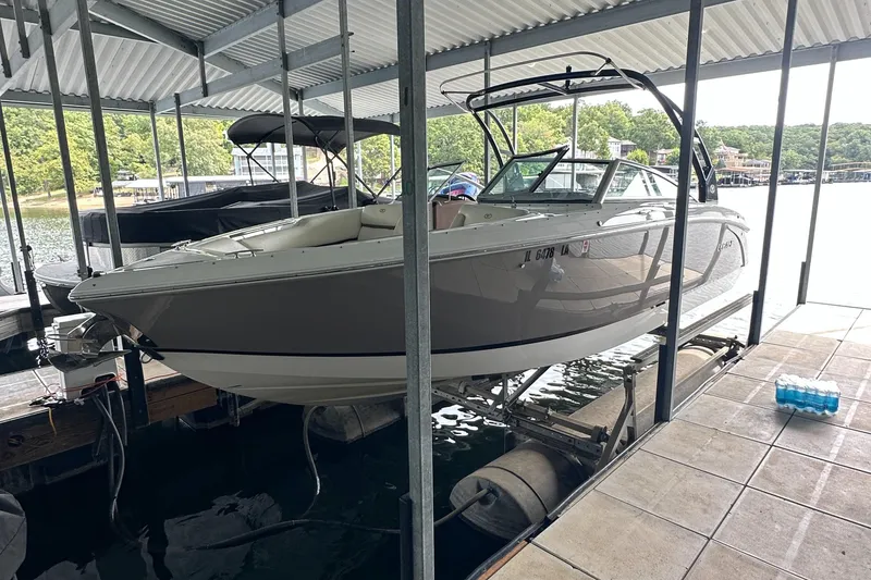 Slide: The Image of 2015 Cobalt R7 boat docked in a covered marina. - 2