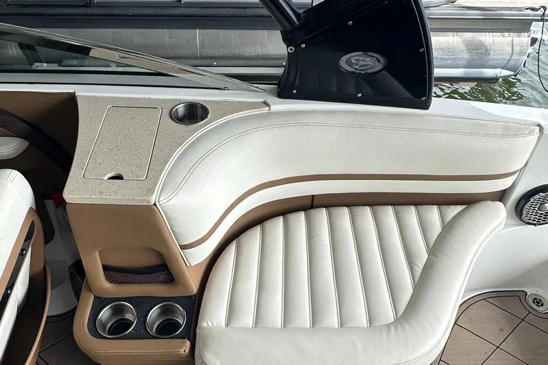 Slide: The Image of 2015 Cobalt R7 boat interior with white leather seating and cup holders. - 22