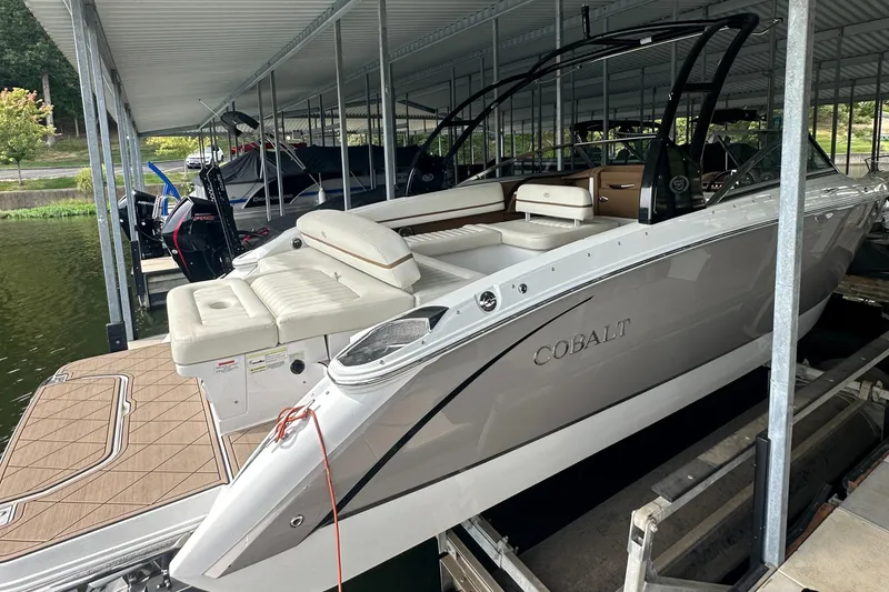 Slide: The Image of 2015 Cobalt R7 boat docked under a covered marina. - 3
