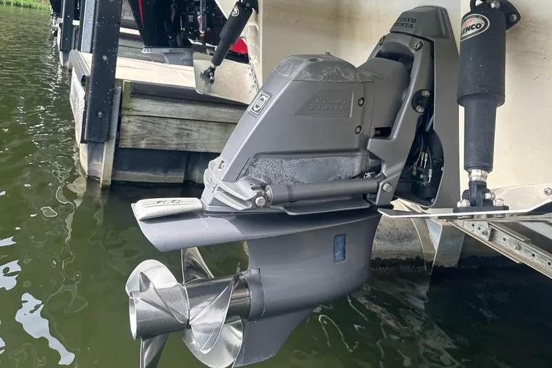 Slide: The Image of 2015 Cobalt R7 boat engine and propeller near dock, partially submerged in water. - 32