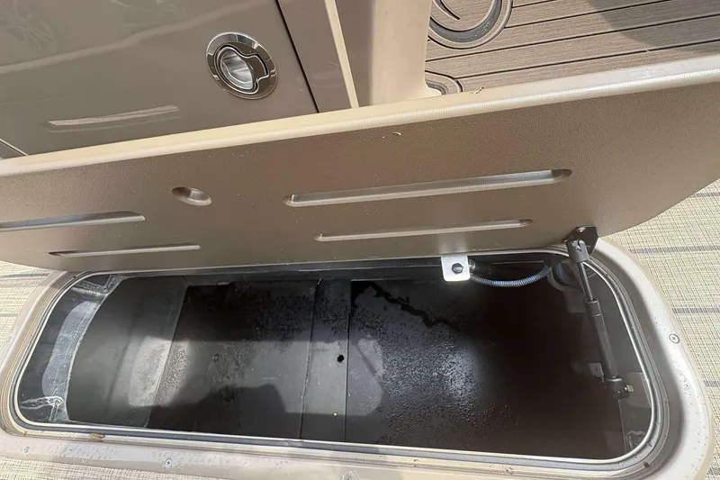 Slide: The Image of Open storage compartment in 2023 Veranda VTX22RC boat, showcasing interior space. - 11