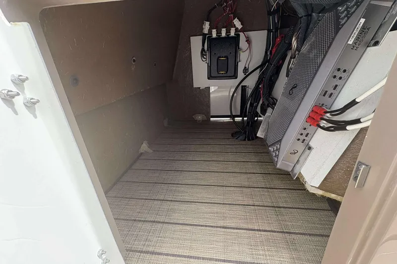 Slide: The Image of Interior view of 2023 Veranda VTX22RC boat compartment with wiring and equipment. - 12