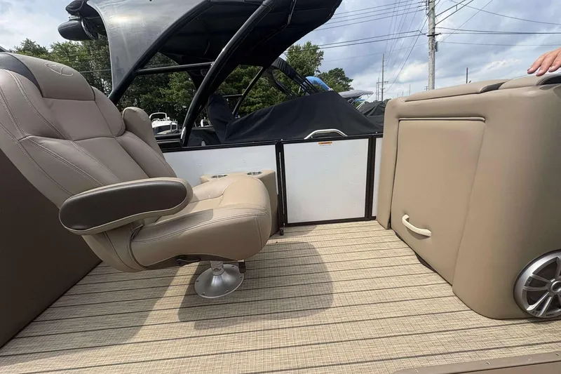 Slide: The Image of 2023 Veranda VTX22RC boat interior with beige seating and modern design. - 13