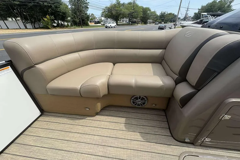 Slide: The Image of 2023 Veranda VTX22RC boat interior with beige cushioned seating and speaker. - 15