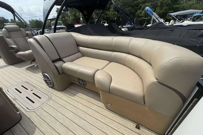 Slide: The Image of 2023 Veranda VTX22RC boat with luxurious beige seating and spacious deck. - 17