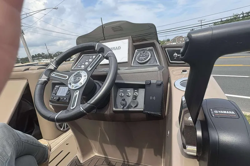 Slide: The Image of 2023 Veranda VTX22RC boat dashboard with steering wheel and Yamaha controls. - 18