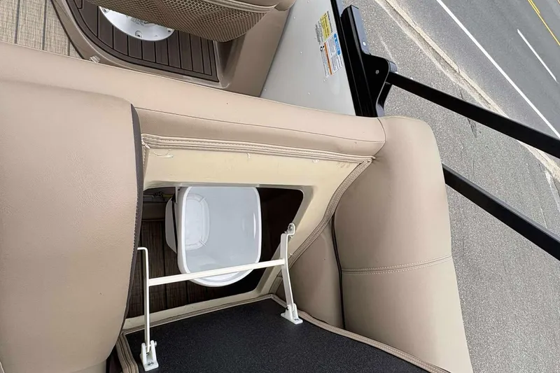 Slide: The Image of 2023 Veranda VTX22RC boat seat storage with integrated trash bin. - 23