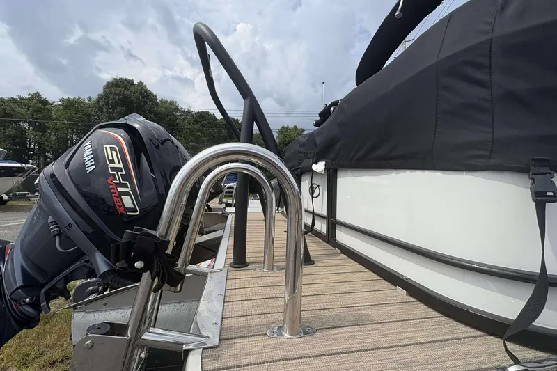 Slide: The Image of 2023 Veranda VTX22RC boat with Yamaha SHO VMAX engine, docked with covered seating area. - 3