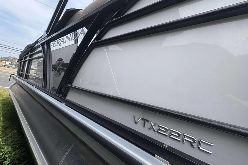 Slide: The Image of 2023 Veranda VTX22RC pontoon boat side view with logo and model name. - 4