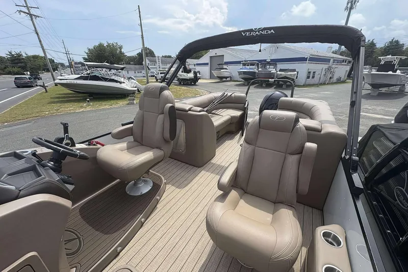 Slide: The Image of 2023 Veranda VTX22RC pontoon boat interior with plush seating and modern design. - 9