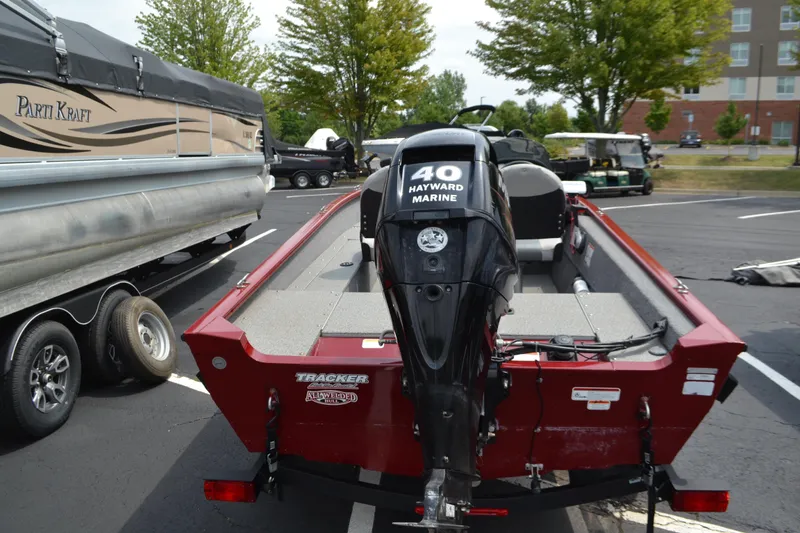 Slide: The Image of 2019 Tracker Super Guide V16 boat with Hayward Marine motor in parking lot. - 2