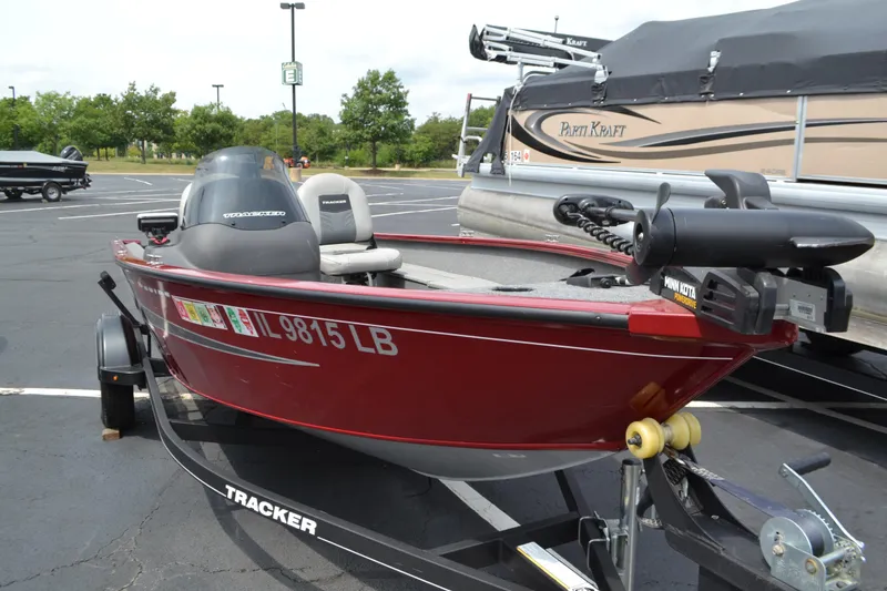 Slide: The Image of 2019 Tracker Super Guide V16 boat on trailer in parking lot. - 4