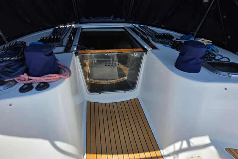 Slide: The Image of 2007 Jeanneau 49 Performance yacht cockpit with ropes and wooden flooring. - 11