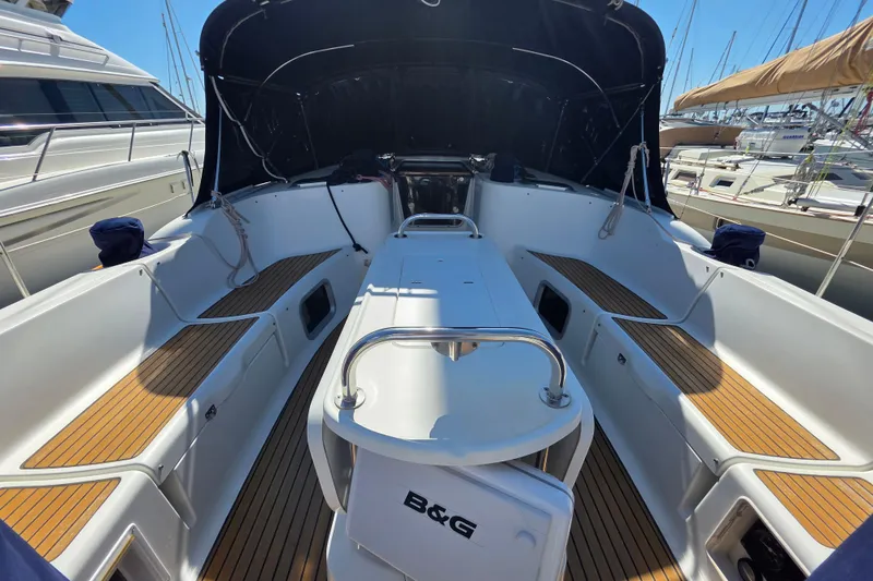 Slide: The Image of 2007 Jeanneau 49 Performance yacht cockpit with teak flooring and covered seating area. - 17