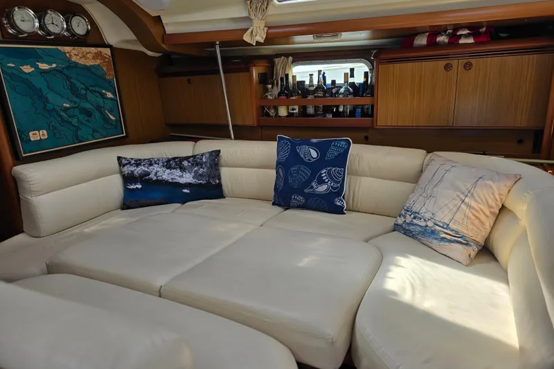 Slide: The Image of Luxurious interior of 2007 Jeanneau 49 Performance yacht with plush seating and nautical decor. - 26
