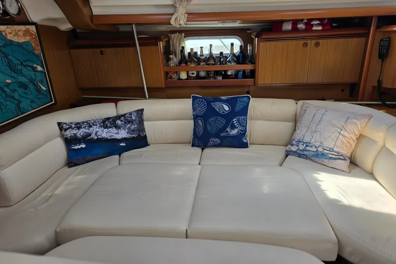 Slide: The Image of Luxurious interior of 2007 Jeanneau 49 Performance yacht with plush seating and decorative pillows. - 28