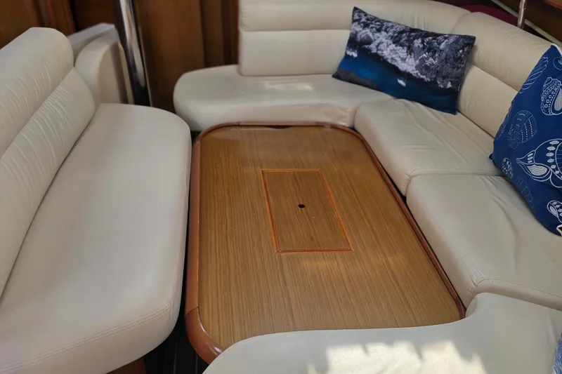 Slide: The Image of Luxurious interior of 2007 Jeanneau 49 Performance yacht with elegant seating and wooden table. - 29