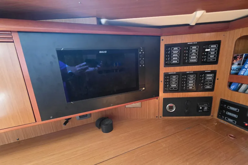 Slide: The Image of Control panel and navigation screen inside a 2007 Jeanneau 49 Performance yacht. - 35