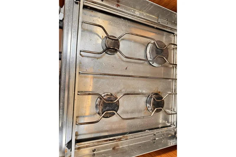 Slide: The Image of Stainless steel stove top on Jeanneau Sun Odyssey 49 Performance yacht, 2007 model. - 41