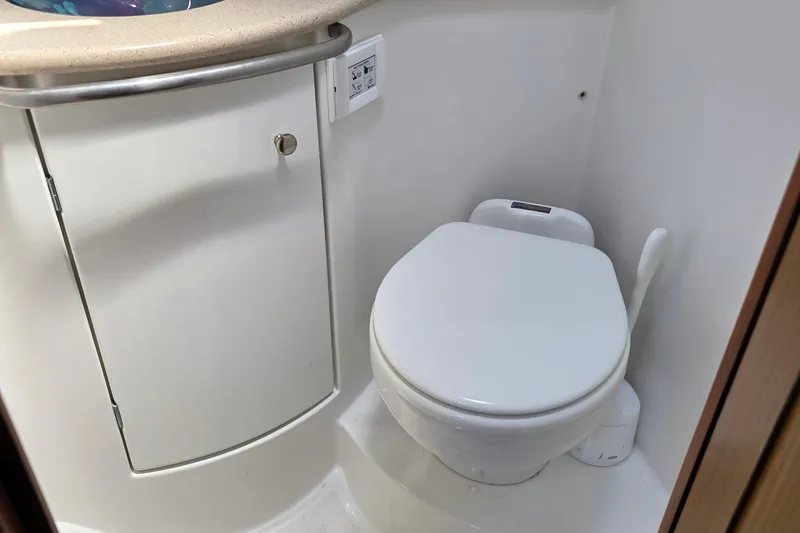 Slide: The Image of Compact bathroom on 2007 Jeanneau 49 Performance yacht, featuring a modern toilet and storage cabinet. - 42