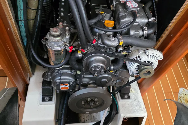 Slide: The Image of Engine compartment of a 2007 Jeanneau 49 Performance sailboat, showcasing mechanical components. - 55