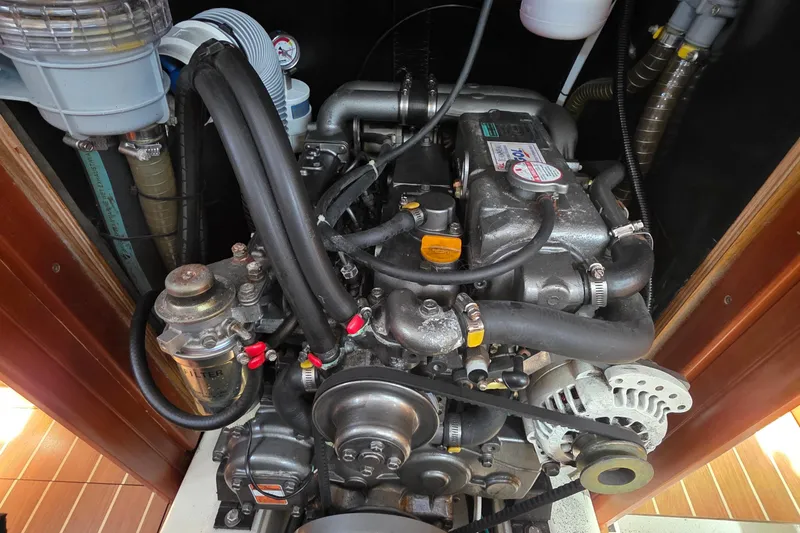 Slide: The Image of Engine of 2007 Jeanneau 49 Performance sailboat, showcasing mechanical components and hoses. - 56